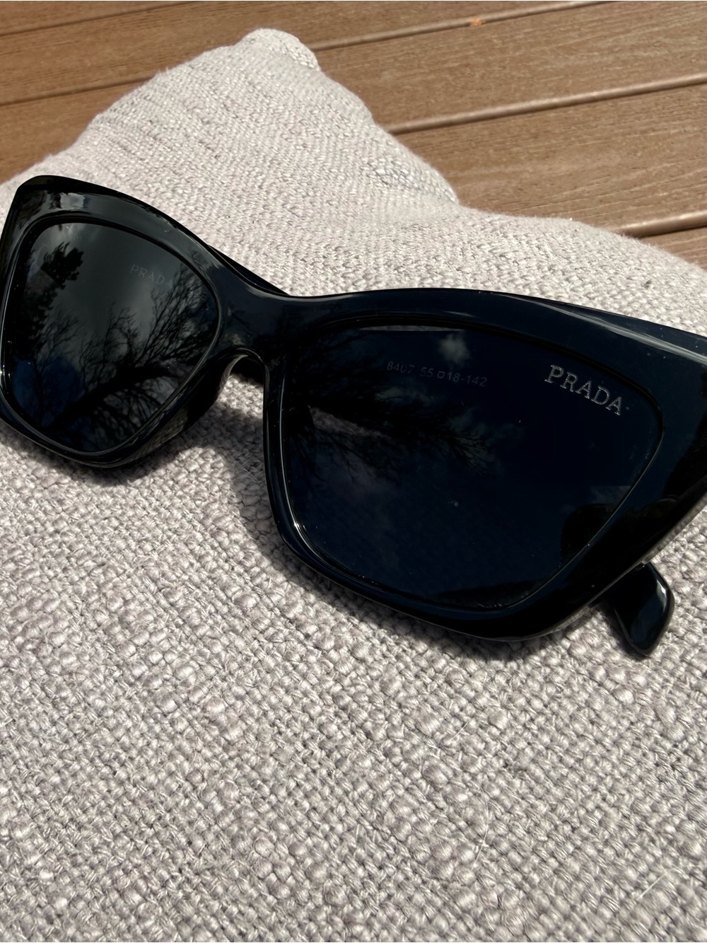 Prada Black Cat-Eye Sunglasses with Dark Lenses